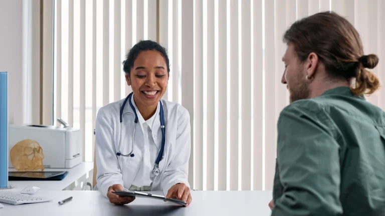 Healthcare professional reviewing benefits information during a hearing care consultation
